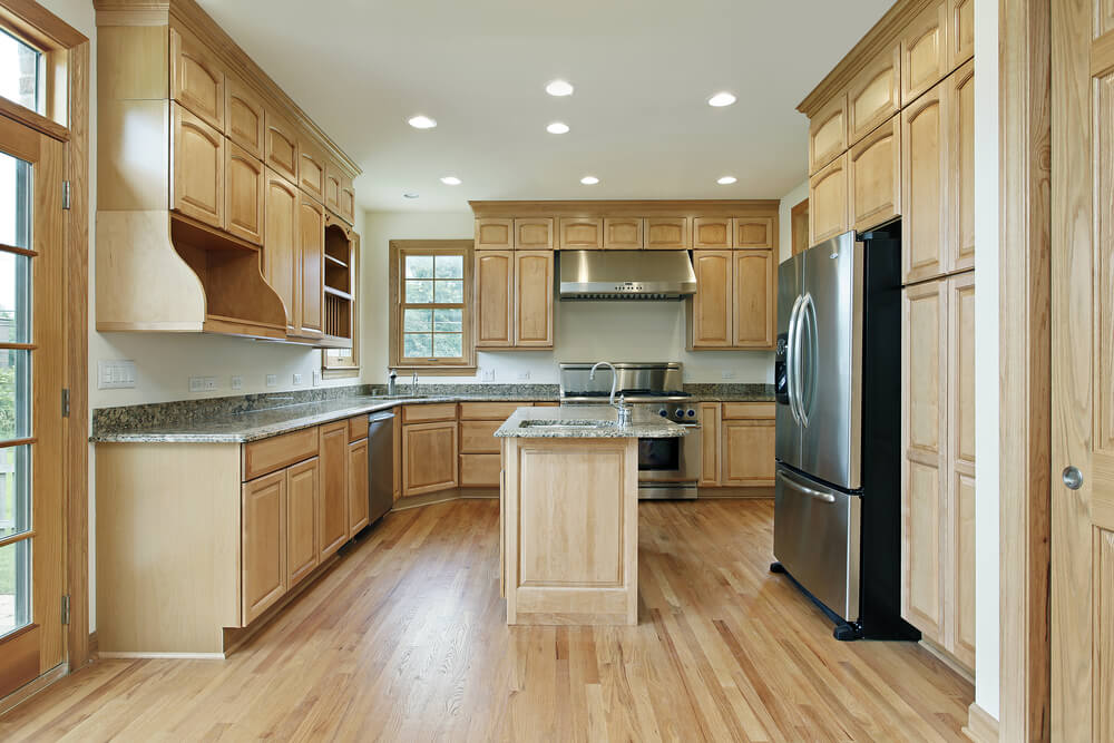 Light hardwood floors with dark cabinets